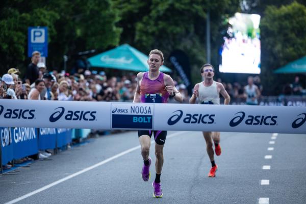 Jude Thomas winning the ASICS Noosa Bolt Photo Korupt Vision